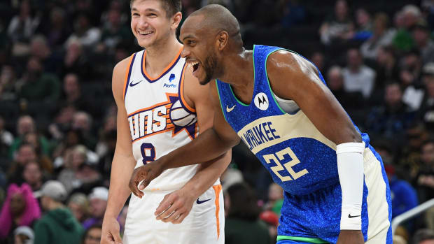  Phoenix Suns guard Grayson Allen (8) and former teammate Milwaukee Bucks forward Khris Middleton (22)